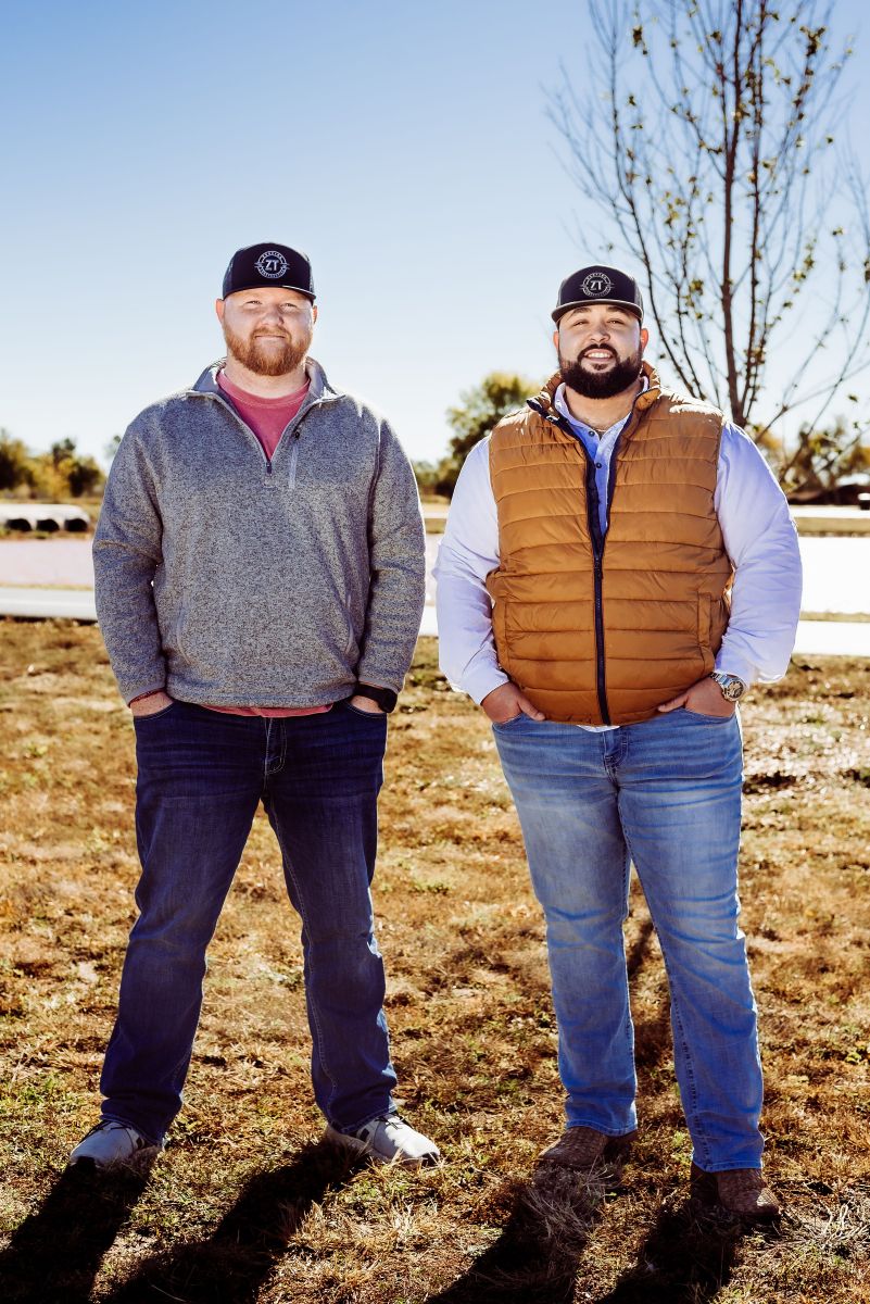 Image of ZT Roofing and Construction owners standing side by side